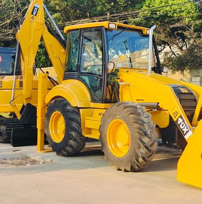 74.6кВт JCB 4CX Подержанный погрузчик Желтый 4378кг Подъемник Подержанный буровой погрузчик Колесо в движении