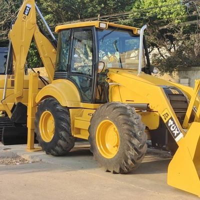 74.6кВт JCB 4CX Подержанный погрузчик Желтый 4378кг Подъемник Подержанный буровой погрузчик Колесо в движении